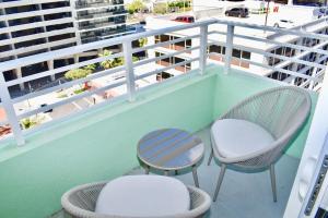 two chairs and a table on a balcony at Landing Modern Apartment with Amazing Amenities (ID2666X16) in Fort Lauderdale