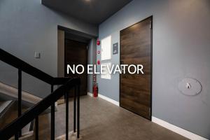 a hallway with a no elevator sign on the wall at Volcano - Vacation STAY 89669 in Kagoshima