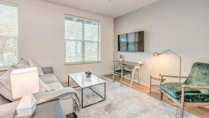 a living room with a couch and a table at Landing Modern Apartment with Amazing Amenities (ID6801) in West Sacramento