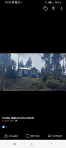 a screen shot of a house with a picture of it at Cabaña Familiar La Polcura in Navidad