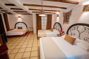 Postel nebo postele na pokoji v ubytování Vilas Insight Hotel Machupicchu