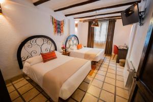 Postel nebo postele na pokoji v ubytování Vilas Insight Hotel Machupicchu