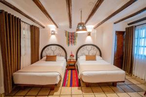 Postel nebo postele na pokoji v ubytování Vilas Insight Hotel Machupicchu