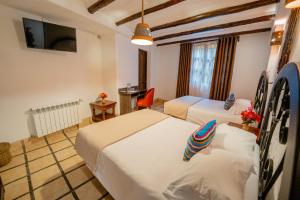 Postel nebo postele na pokoji v ubytování Vilas Insight Hotel Machupicchu