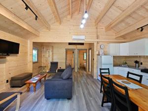 a living room with a couch and a table at Parkway Cottage Resort and Trading Post in Dwight