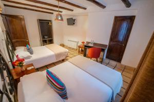 Postel nebo postele na pokoji v ubytování Vilas Insight Hotel Machupicchu