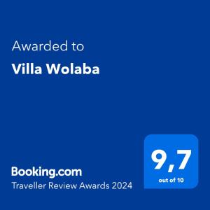 a blue text box with the words awarded to villa wolbia at Villa Wolaba in Puerto Viejo
