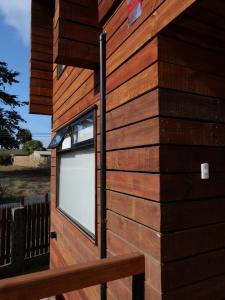 a building with a window on the side of it at M House Pichilemu in Pichilemu