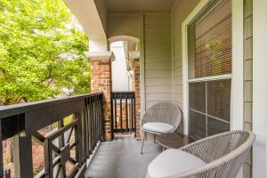 a porch with two chairs and a window at Landing Modern Apartment with Amazing Amenities (ID5301X35) in Irving