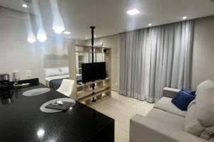 Et tv og/eller underholdning på Studio 100% mobiliado e decorado 26