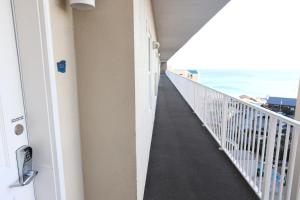 a hallway leading to the beach from a balcony at Laketown Wharf 1233 luxury condo in Panama City Beach