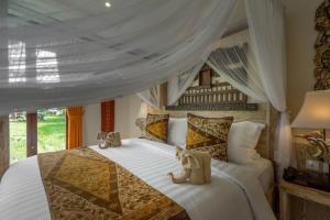 Letto o letti in una camera di Gefecon Villa Ubud