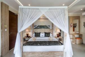 Letto o letti in una camera di Gefecon Villa Ubud