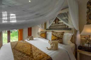 Letto o letti in una camera di Gefecon Villa Ubud