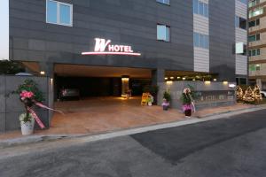 a view of a hotel with christmas decorations in front of it at W hotel in Incheon