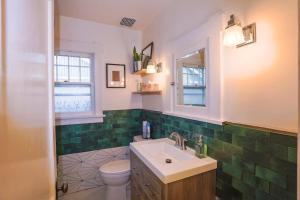 a bathroom with a sink and a toilet at Excellent Location Mins from Dining & DT! in Denver