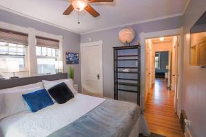 a bedroom with a bed and a ceiling fan at Excellent Location Mins from Dining & DT! in Denver