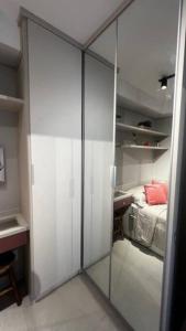 Postel nebo postele na pokoji v ubytování Studio Cidade Maia equipado 13