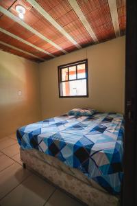 - une chambre avec un lit dans l'établissement Pousada Salinas Valle, à Tramandaí