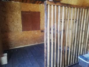 a room with wooden corrugated walls and a window at Cabañas Miranda in La De