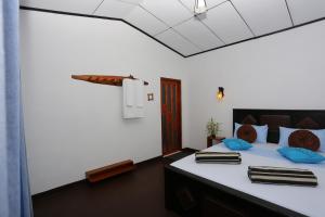Postel nebo postele na pokoji v ubytování Leisure Dream Inn