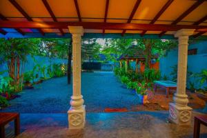 a view of a porch with a table and trees at Bakini Villa - Ahangama in Ahangama