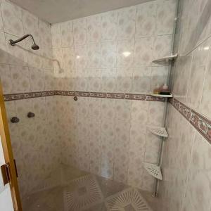 a bathroom with a shower with a glass floor at Hermoso departamento con Patio in Apizaco
