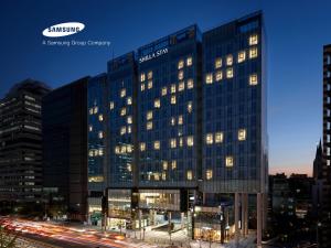 a building with a samsung sign on the side of it at Shilla Stay Gangnam Yeoksam in Seoul