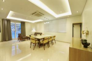 a dining room with a table and chairs at Hotel B in Gwangju