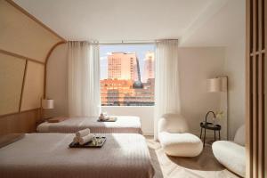 Voodi või voodid majutusasutuse The Ann Hanoi Hotel & Spa toas