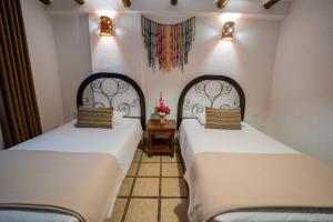 Postel nebo postele na pokoji v ubytování Vilas Insight Hotel Machupicchu