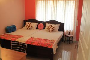 Postel nebo postele na pokoji v ubytování Oshin Home Stay