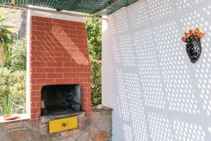 a brick oven with a brick wall at Portysud in Lipari