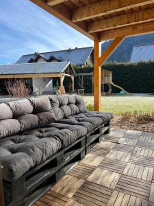 a wooden bench sitting on a wooden deck at Ferienwohnung Eden in Sachsenburg