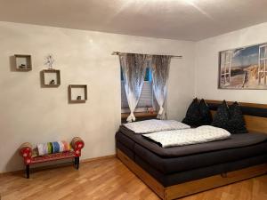 a bedroom with a bed and a window at Ferienwohnung Eden in Sachsenburg