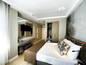 Postel nebo postele na pokoji v ubytování Alessia Hotel