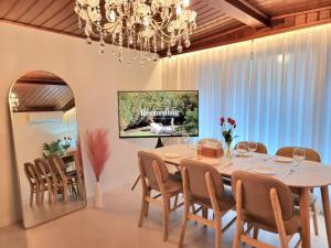 a dining room with a table and chairs and a chandelier at Classic LeeYou in Seoul