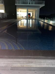 an empty swimming pool in a building at night at Condotel810byWVtowers1&2 in Iloilo City