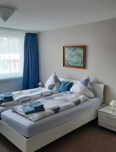 Säng eller sängar i ett rum på Holiday Apartment Davos Residence