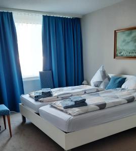 Postel nebo postele na pokoji v ubytování Holiday Apartment Davos Residence