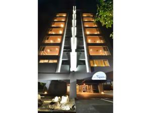 a tall white building with a lot of windows at Oita Onsen Business Resort Kyuan - Vacation STAY 50166v in Oita