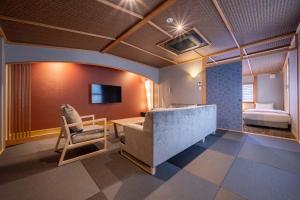 a room with a bed and a desk and a bedroom at RESI STAY Fuyacho in Kyoto
