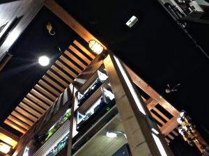 an overhead view of a bar with wooden stairs at Koke Musu inn in Otsu