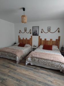 Postel nebo postele na pokoji v ubytování Gîte La Petite Longère