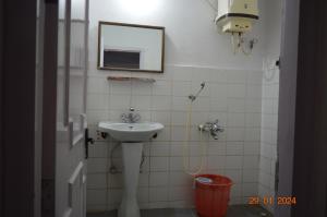 a bathroom with a sink and a mirror at Mystical Medows in Ooty +41 photos