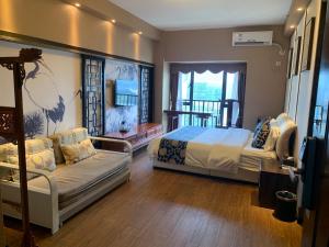Rúm í herbergi á Pazhou Yixiu Boutique Apartment Canton Fair Branch
