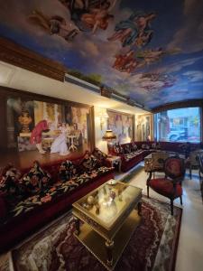 a living room with a painting on the ceiling at Q Hotel in Beirut