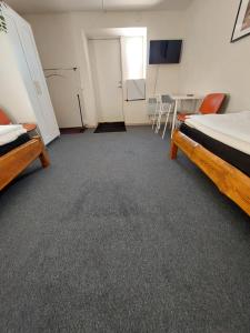 Ένα ή περισσότερα κρεβάτια σε δωμάτιο στο Purku Keskus