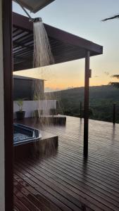 a water fountain on the deck of a house at Longview - stunning views, sleeps 7 in Port Vila