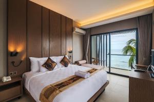 Ένα ή περισσότερα κρεβάτια σε δωμάτιο στο Padmasari Resort Lovina +111 φωτογραφίες